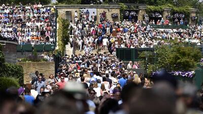 Spectators crowd into the grounds at the 2014 Wimbledon Championships on Tuesday. Toby Melville / Reuters / June 24, 2014