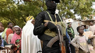 A police officer stands guard at a market near Diffa airport in south-eastern Niger, near the border with Nigeria, on December 23. AFP