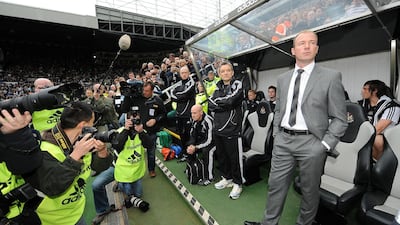 Numerous photographers point their camera at Alan Shearer as he takes his place in the Newcastle United dugout. PA
