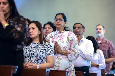 Worshippers come together for an Easter service held at St Joseph's Cathedral in Abu Dhabi.Victor Besa / the National