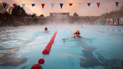Early morning swimmers enjoy the water during sunrise at the Charlton Lido in Hornfair Park in London on its first day of reopening after the second national lockdown ended. AP Photo