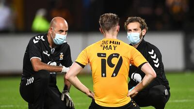 Cambridge United's Adam May receives treatment for an injury during the EFL Trophy Southern Group H match at the Abbey Stadium, Cambridge. PA Photo