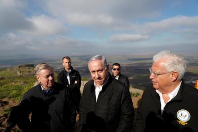 US Ambassador to Israel David Friedman, right, visits the Golan Heights with Israeli Prime Minister Benjamin Netanyahu and US Senator Lindsey Graham on March 11, 2019. Reuters