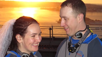 Sydneysiders Katrina Aplitt (L) and Cameron McCloughan (R) take their wedding vows at dawn on Valentine's Day on top of the Sydney Harbour Bridge. More than 4000 couples have become engaged and 20 weddings have taken place on the summit of the iron arch???