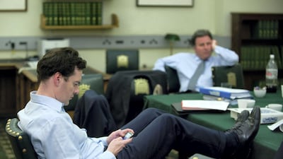 George Osborne checks his Blackberry in David Cameron's office in Portcullis House in the early hours of the morning during talks with the Liberal Democrats to form a coalition government in May 2010. Getty Images