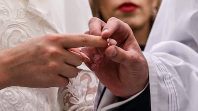 More expats are expected to tie the knot in the Emirates rather than travel home or abroad to wed. EPA