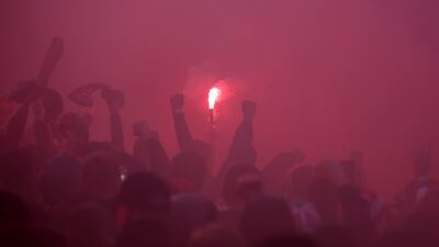 Liverpool fans with flares outside the stadium. Reuters