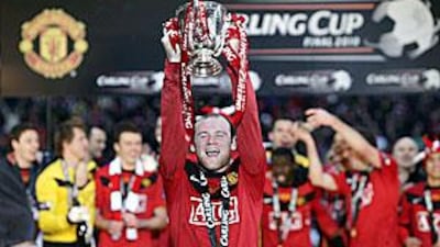 Wayne Rooney lifts the Carling Cup at Wembley after Manchester United beat Aston Villa.