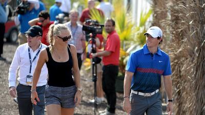 Rory McIlroy and Caroline Wozniacki at the 2013 DP World Tour Championship. They got engaged over New Year's Eve 2013 and McIlroy finished tied for second at the 2014 Abu Dhabi Golf Championship ahead of this week's Dubai Desert Classic, where he'll compete in Dubai for the 13th time. Ross Kinnaird / Getty Images