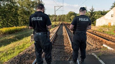 Police officers patrolling the railway tracks on a line between Walbrzych and Wroclaw, in Walbrzych’s suburbs, Poland. Maciej Kulczynski/EPA
