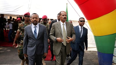 Ethiopian Prime Minister Abiy Ahmed, left, and Eritrean President Isaias Afwerki attend the reopening of the Eritrean embassy in Addis Ababa on July 16, 2018. Reuters