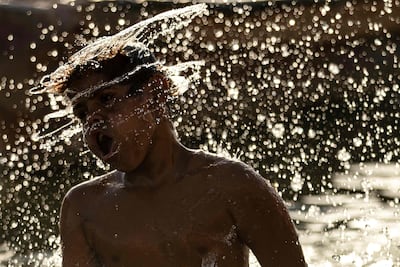 A boy cools off in the Shatt Al Arab waterway. AFP