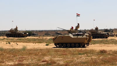 Egyptian armored vehicles near the border crossing between Egypt and Gaza, in March 2024. EPA