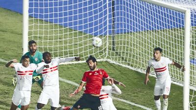 Al Ahl forward Marwan Mohsen jumps for a header. AFP