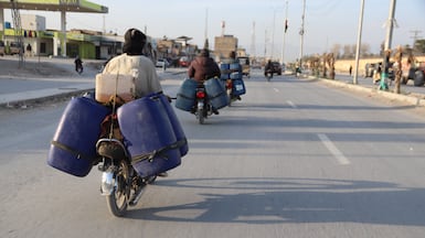 Vendors transport jerrycans filled with petrol on their motorcycles on the outskirts of Quetta, Balochistan province, Pakistan, 30 March 2026. The trade in smuggled Iranian fuel, a long-standing livelihood for many in Balochistan, has been increasingly affected by the recent US-Israel-Iran conflict, which has disrupted cross-border supply routes and driven up global oil prices. With tensions impacting shipping through key routes such as the Strait of Hormuz and tightening fuel availability, informal fuel transport has become more uncertain and costly, reflecting the wider economic strain and energy disruptions felt across Pakistan and the region. EPA / FAYYAZ AHMED