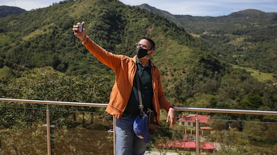 A tourist takes a selfie in Colombia, which is one of only seven countries currently on the red list. Getty Images