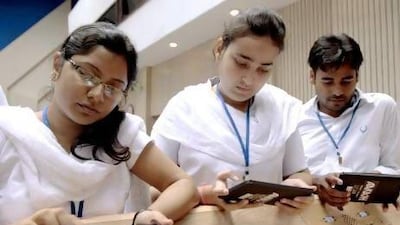 A group of students tries the Aakash low-cost tablet after its launch in October 2011. Pankaj Nangia / Bloomberg