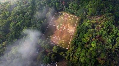 An aerial view of a football field at the Teoca volcano crater in the town of Santa Cecilia Tepetlapa, on the outskirts of Mexico City, taken on July 9, 2023. AFP