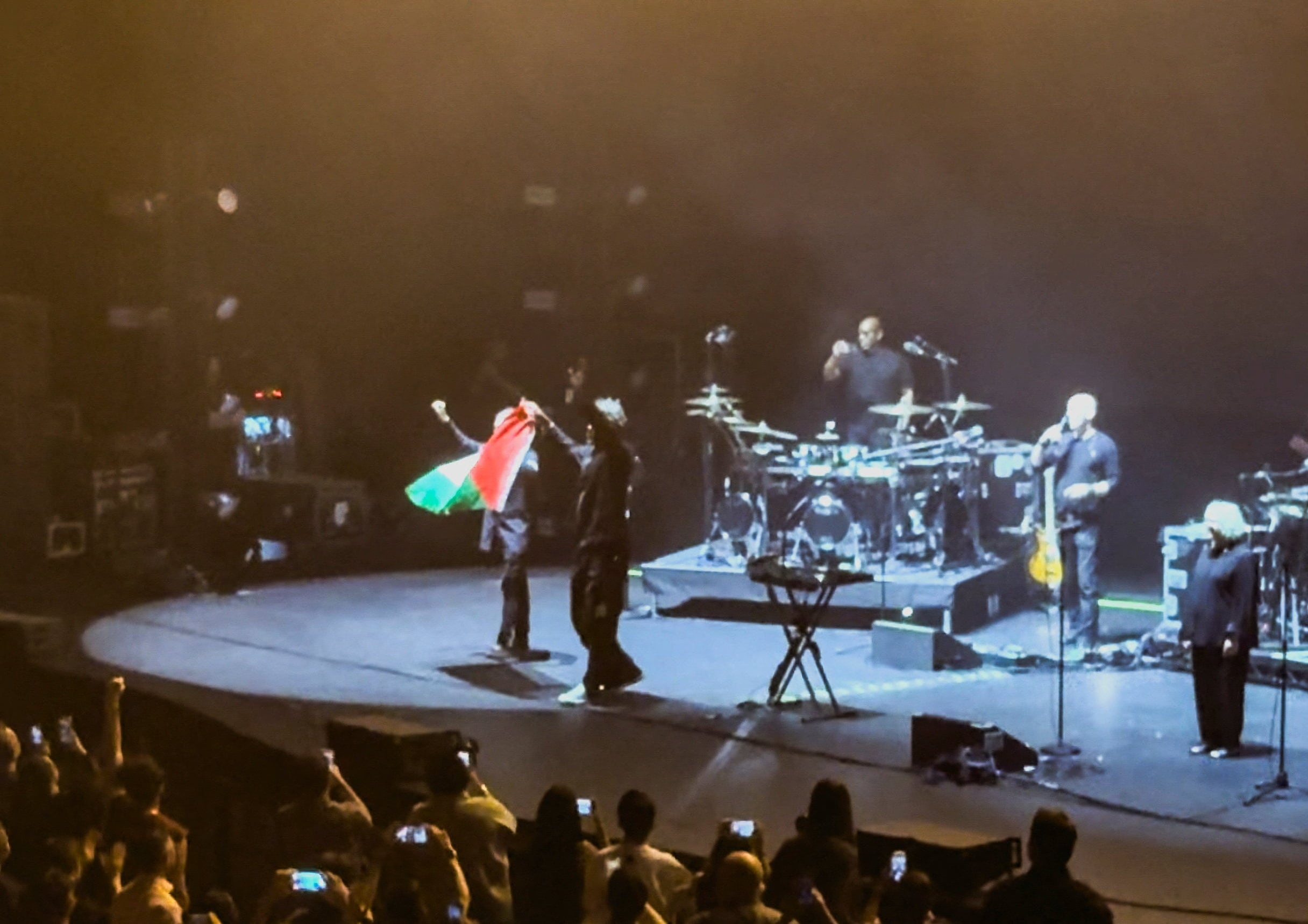 Image linked from the original feed: UK band Massive Attack banned from Singapore over 'foreign' Palestinian flag at concert
