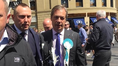 Brexit Party leader Nigel Farage after being hit with a milkshake during an election campaign walkabout in Newcastle, England. AP