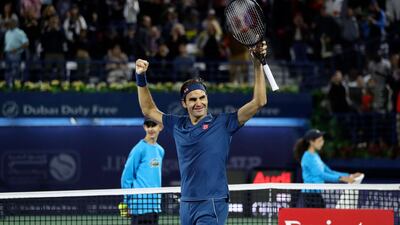 Roger Federer celebrates winning his eighth Dubai title. AFP
