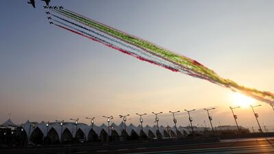 Planes spray the UAE flag colours over the track ahead of the Grand Prix at the Yas Marina racetrack. AP Photo