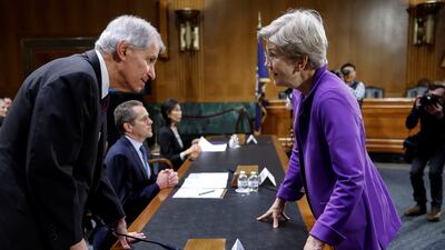 US senator Elizabeth Warren speaks to Federal Deposit Insurance Corporation chairman Martin J. Gruenberg before a committee hearing on 'Recent Bank Failures and the Federal Regulatory Response', in Washington. Reuters