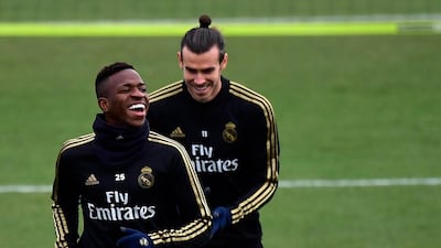 Real Madrid's Brazilian forward Vinicius Junior and Welsh forward Gareth Bale laugh during a training session. AFP