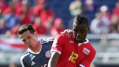 Costa Rica’s Joel Campbell, right, and Paraguay’s Celso Ortiz vie for the ball during their match in Orlando, Florida. Gregg Newton / AFP