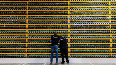 Technicians inspecting Bitcoin mining at Bitfarms in Quebec. AFP