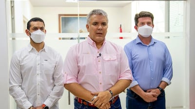 In this photo released by Colombia's Presidency, President Ivan Duque speaks, flanked by Interior Minster Daniel Palacios and Defense Minister Diego Molano, in Cucuta, Colombia. AP Photo