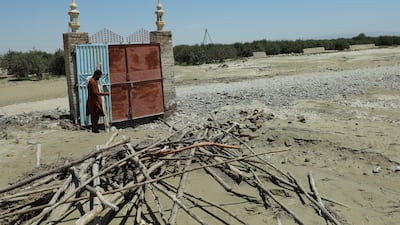 A man on the site of a mosque that was washed away by floods in Balochistan province, Pakistan. According to disaster management authorities about 160 bridges and 5,000 kilometres of roads have been destroyed or damaged. More than 33 million people are affected by the floods, the country's climate change minister said. EPA