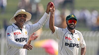 Pakistan's Noman Ali, left, Sajid Khan celebrate after their nine-wicket victory against England in the third Test at the Rawalpindi Cricket Stadium on October 26, 2024. The spinners shared all 10 wickets in the visitors' second innings as the hosts won the three-Test series 2-1. AFP