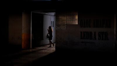 A woman enters in a car park near the Ledra main shopping street in central capital Nicosia, Cyprus. AP Photo