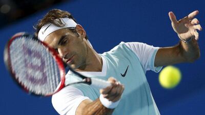 Roger Federer hits a return to Andy Murray. Ahmed Jadallah / Reuters