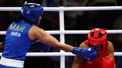 Chantelle Jordan Reid of Great Britain (red) and Khadija Mardi of Morocco (blue) in action. EPA