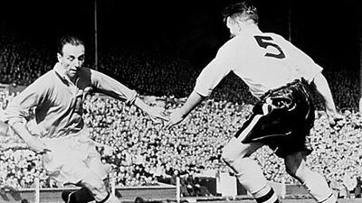 Blackpool's Stanley Matthews, left, known as the "Wizard of Dribble", takes on the Bolton defence in the 1953 FA Cup final. The winger helped his side battle back from 3-1 down to win 4-3 in what would later be known as the "Matthews Final".