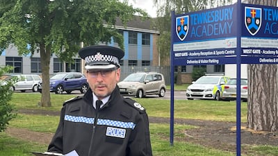 Assistant chief constable Richard Ocone, of Gloucestershire Police, reads a statement outside Tewkesbury Academy in Gloucestershire after a teacher was stabbed there on July 10. PA