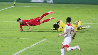 Wu Lei of China is brought down in the penalty area by Syria's Ibrahim Alma. China won the match 3-1, but both sides continue on the road to Qatar 2022. Getty Images
