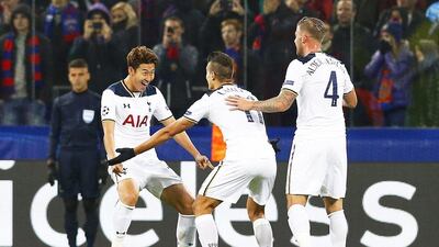 Son Heung-min of Tottenham Hotspur celebrates with his teammates Erik Lamela, centre, and Toby Alderweireld, right, after scoring. Maxim Shipenkov / EPA