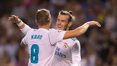 Real Madrid's Toni Kroos, left, is congratulated by Gareth Bale after scoring Real's third goal against Deportivo La Coruna at the Riazor Coruna, Spain, on Sunday, August 20, 2017. Lalo R. Villar / AP Photo