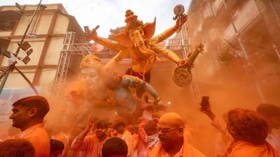 Devotees carry an idol of the Hindu deity Ganesha to be immersed in the Arabian Sea during the Ganesh Chaturthi festival in Mumbai, India. AFP