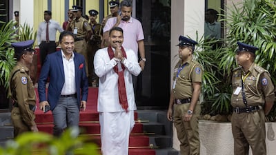Sri Lanka Podujana Peramuna party presidential candidate Namal Rajapaksa, centre, leaves the Election Commission after the election results are announced. Bloomberg
