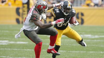 Antonio Brown, right, leads the NFL in receiving yards and receptions. Gene J Puskar / AP