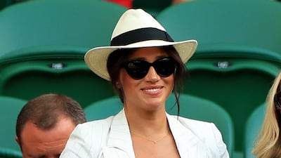 Meghan, Duchess of Sussex, in a L'Agence blazer, watches Serena Williams on day four of the Wimbledon Championships at the All England Lawn Tennis and Croquet Club. PA