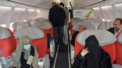 Sick Yemenis board a UN medical evacuation plane at Sana'a airport, Yemen. EPA