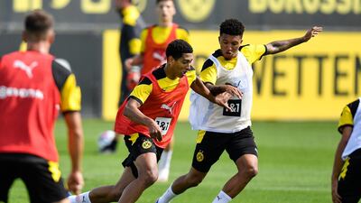 Jude Bellingham, left, fights for the ball with Jadon Sancho during the first training session of Borussia Dortmund. AP Photo