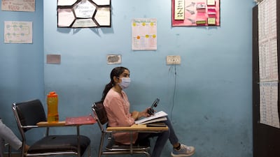 Ranjit Kaur, a microbiologist who works at a hospital in Jalandhar, is taking classes to prepare for mandatory English language exams so she can continue her studies in the West