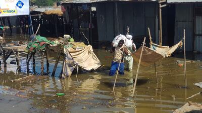 Residents of N'djamena saving possessions from their submerged homes. Reuters