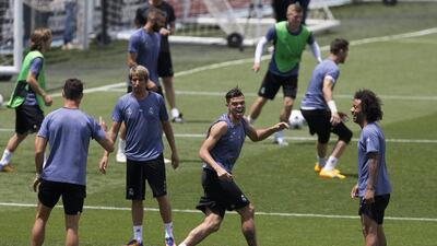 Real Madrid's Pepe, centre, reacts during the training session. Paul White / AP